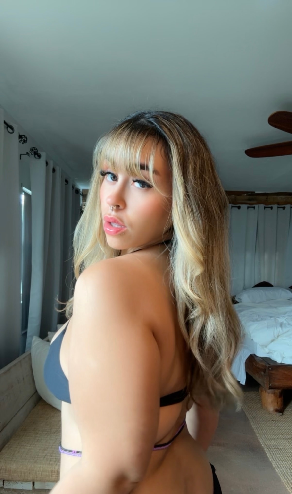 Chechi looking over shoulder indoors