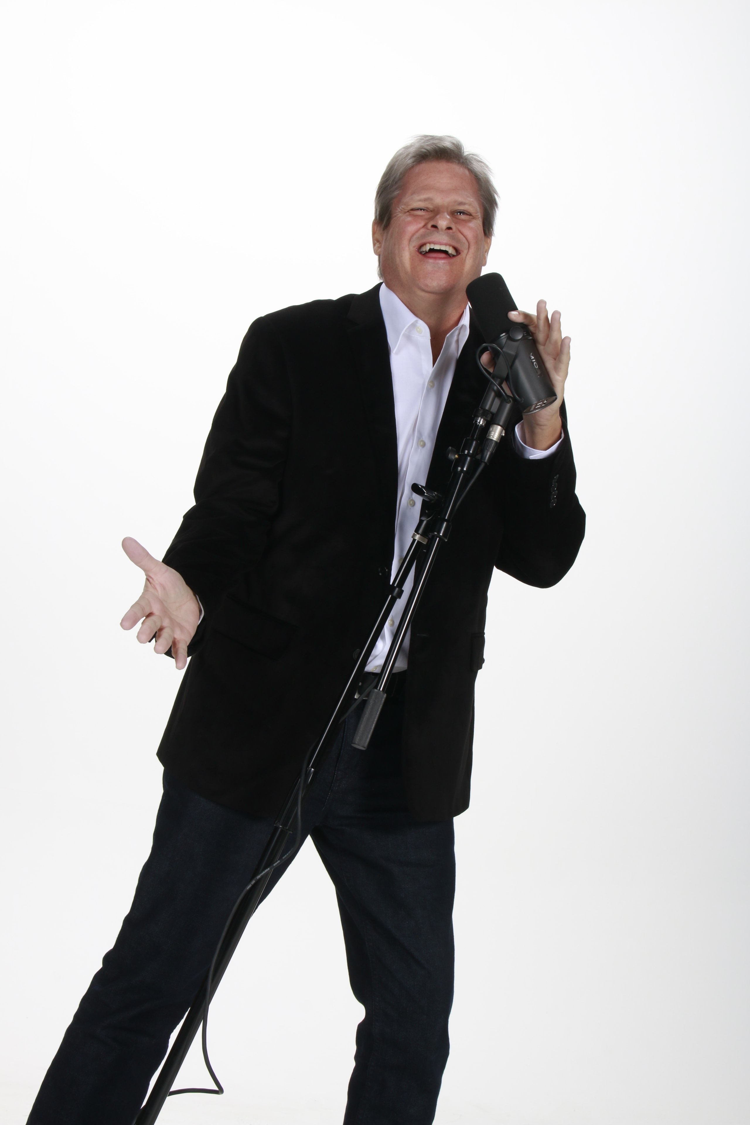 Ken performing with microphone stand