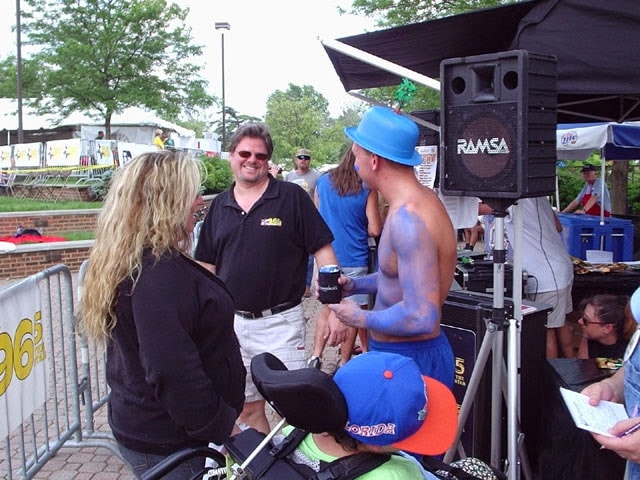 Ken at outdoor radio event with fans